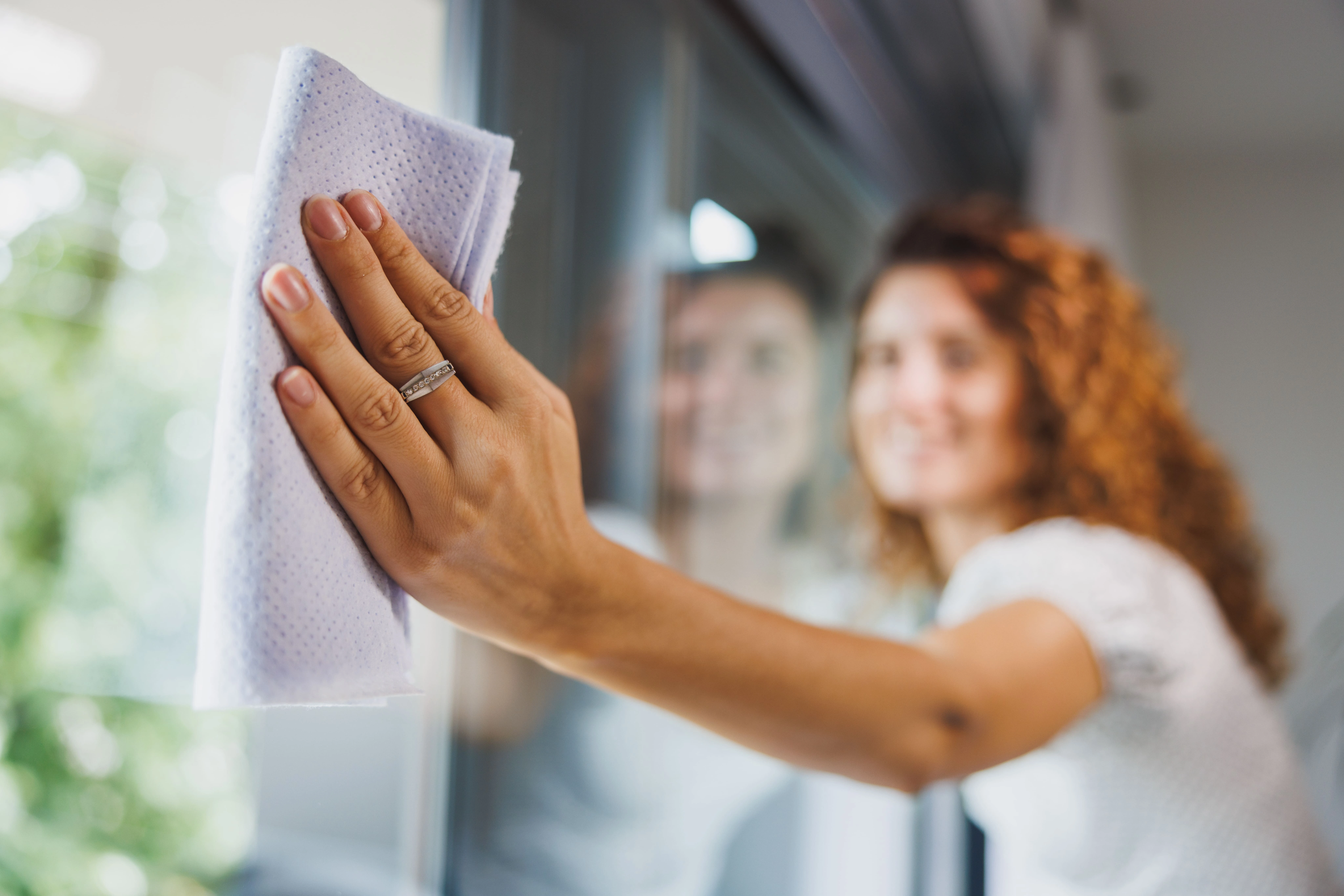 woman-cleaning-window-glass